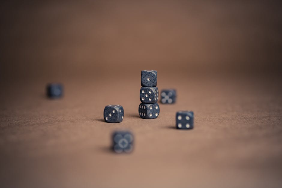Artistic display of stacked dice showcasing luck and chance in a minimalist composition.