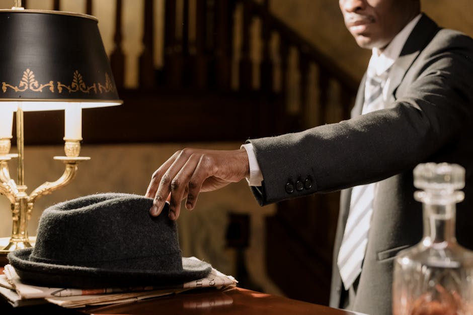 A moody noir detective scene with a man reaching for a fedora under warm lighting.
