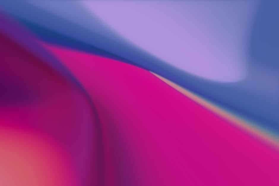 Colorful abstract gradient background with flowing shapes and vibrant hues.