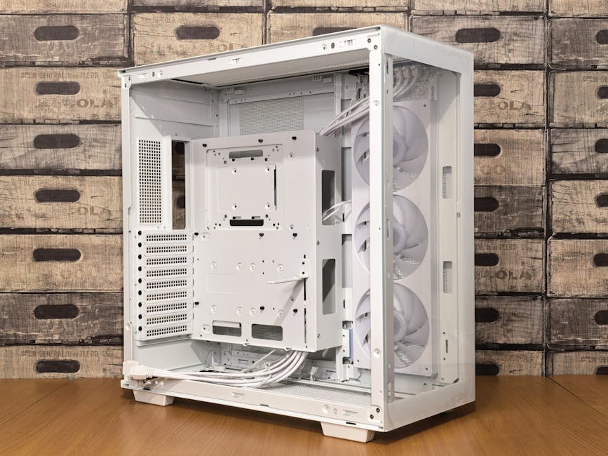 Open sleek white PC case with multiple fans, set against a rustic wooden crate background.