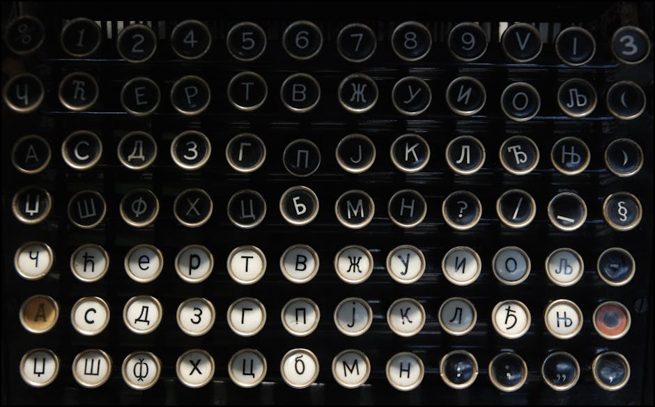 Close-up of a vintage typewriter keyboard featuring Cyrillic letters and numbers.