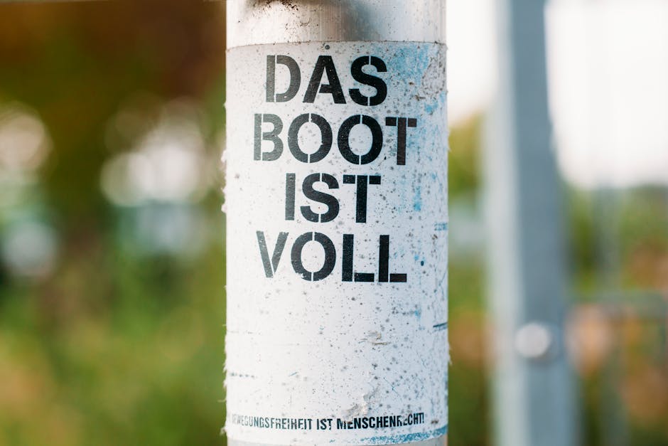Close-up of graffiti 'Das Boot Ist Voll' on a post in Bubenreuth, Germany.