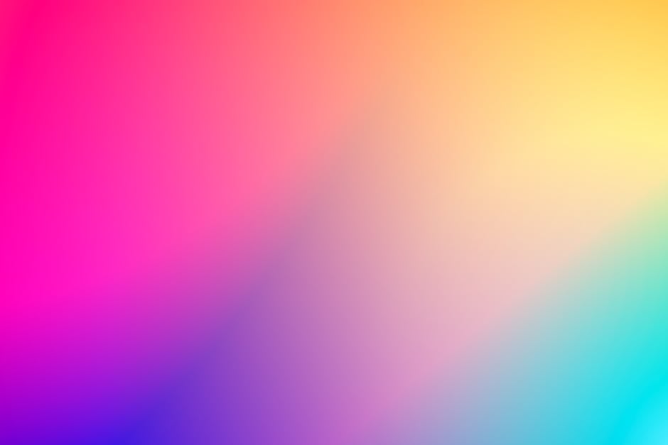 A seamless blend of vibrant pink and yellow hues in a smooth gradient, perfect for backgrounds.