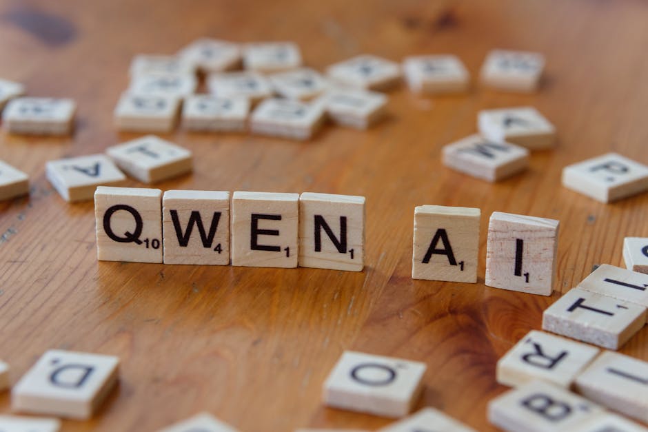 Scrabble-like tiles arranged to spell 'Qwen AI' on a wooden surface, depicting technology concepts.