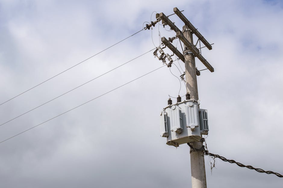 Low-angle shot of a power line on an electric post against a cloudy sky in São Paulo, Brazil.