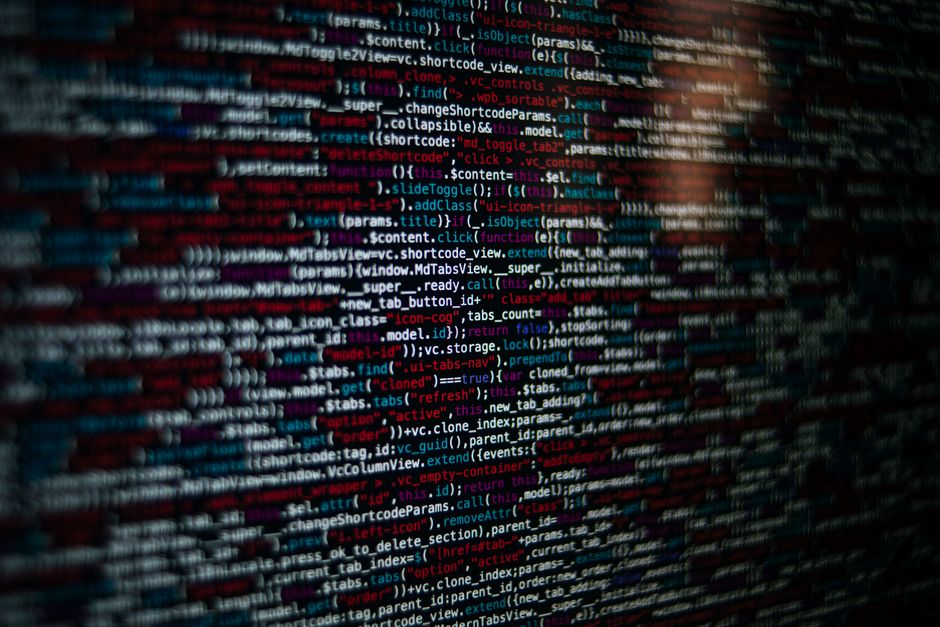 Detailed image of computer source code displayed on a screen, showcasing web development elements.